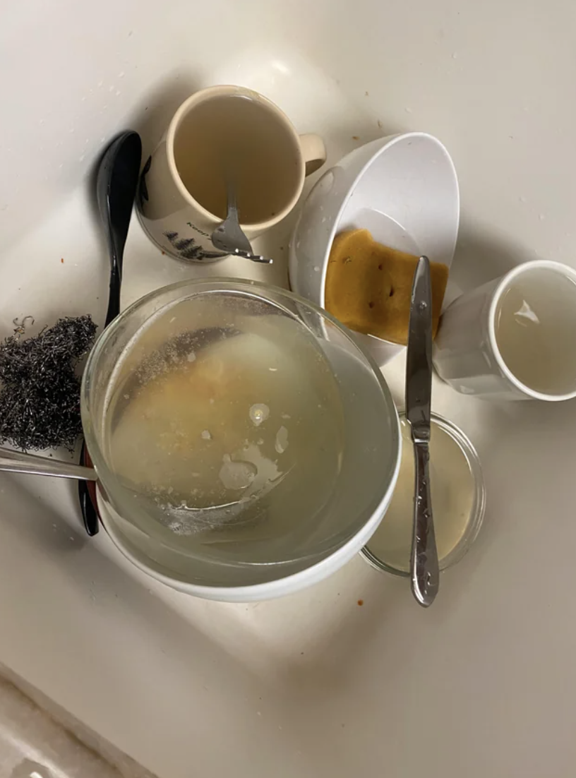 a sink with dirty dishes