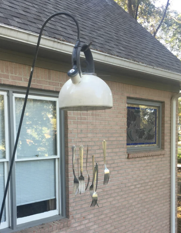 A wind chime made of a pot and forks