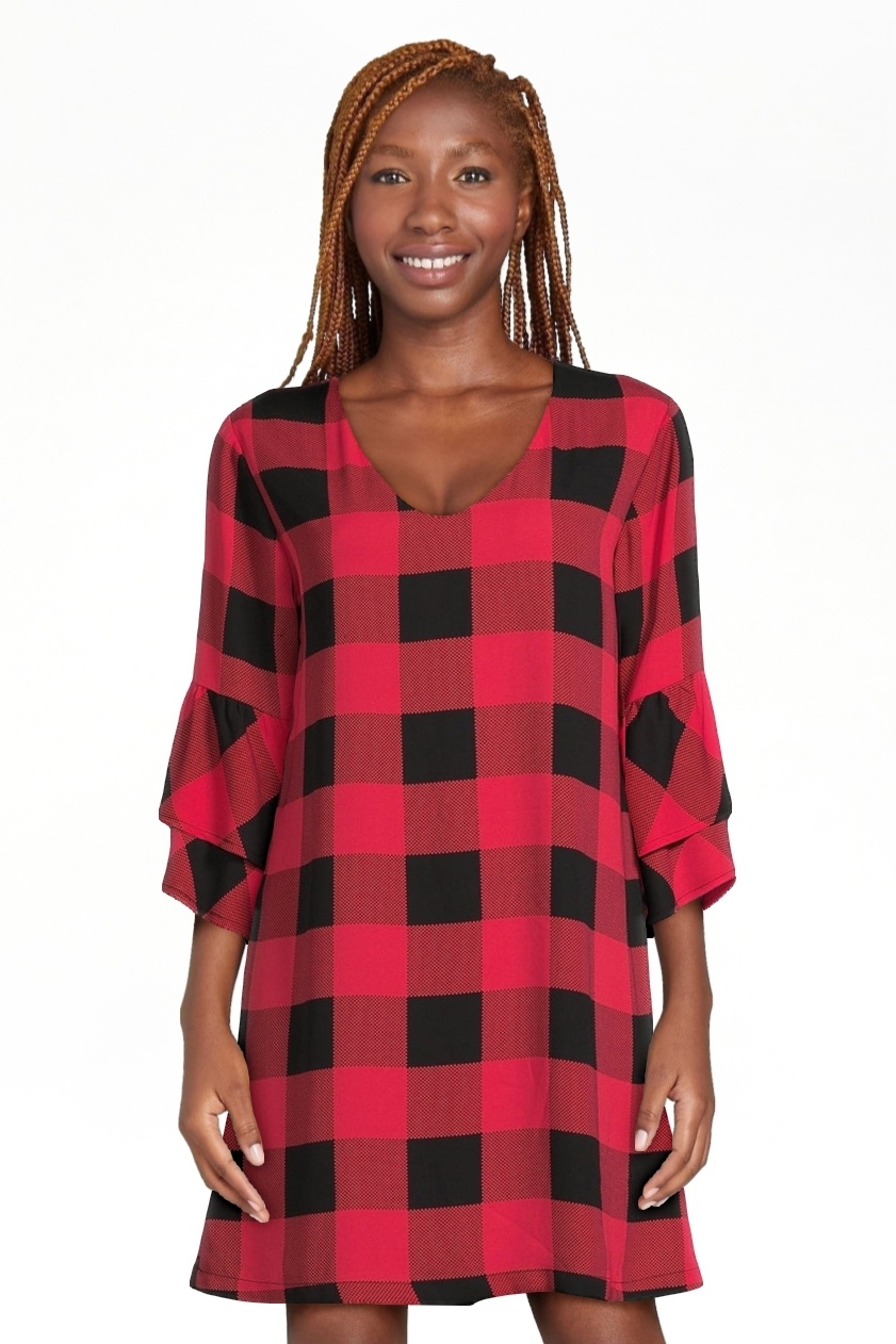 model wearing the red plaid dress