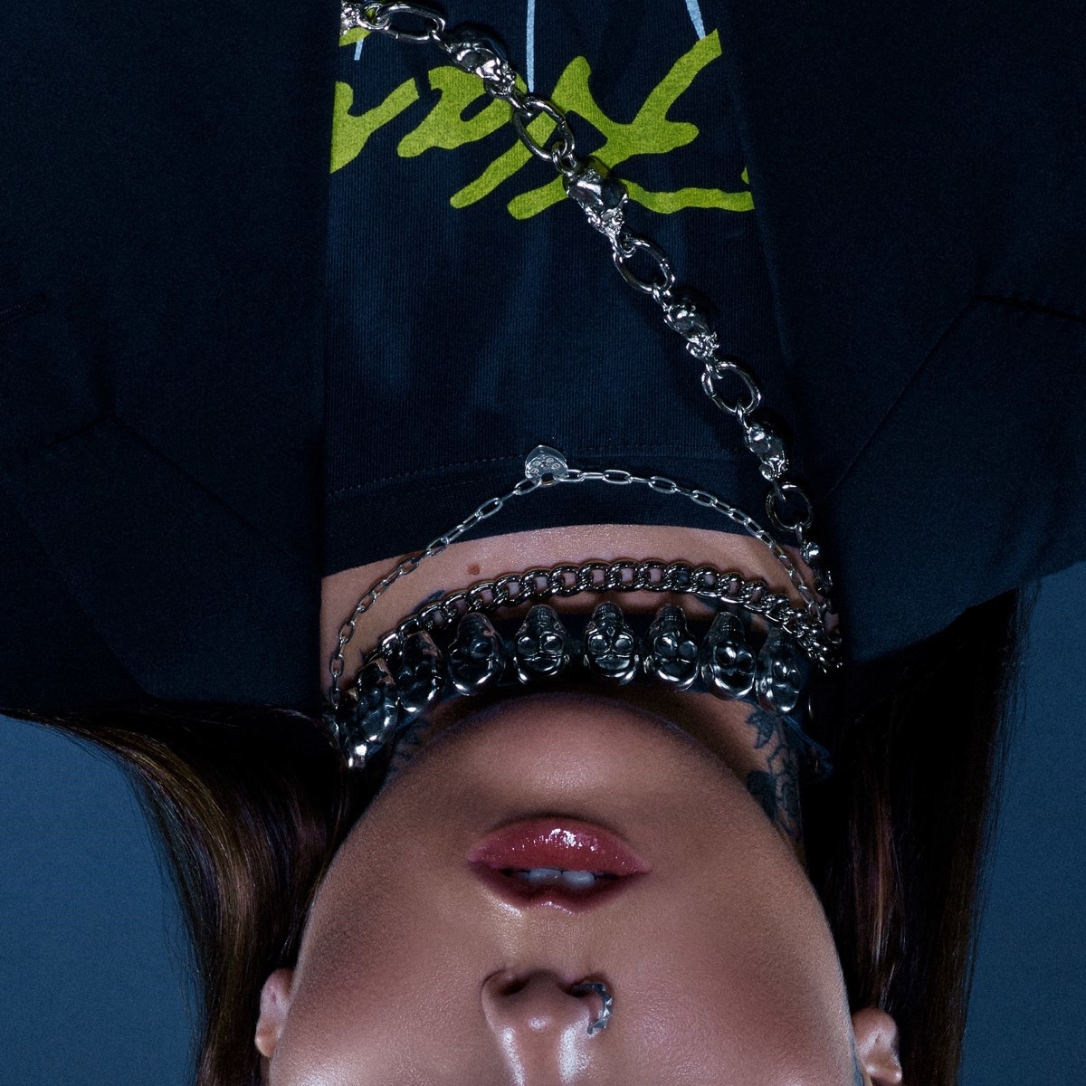 Single cover for &quot;Strangers&quot; by Kenya Grace, showing Kenya upside down