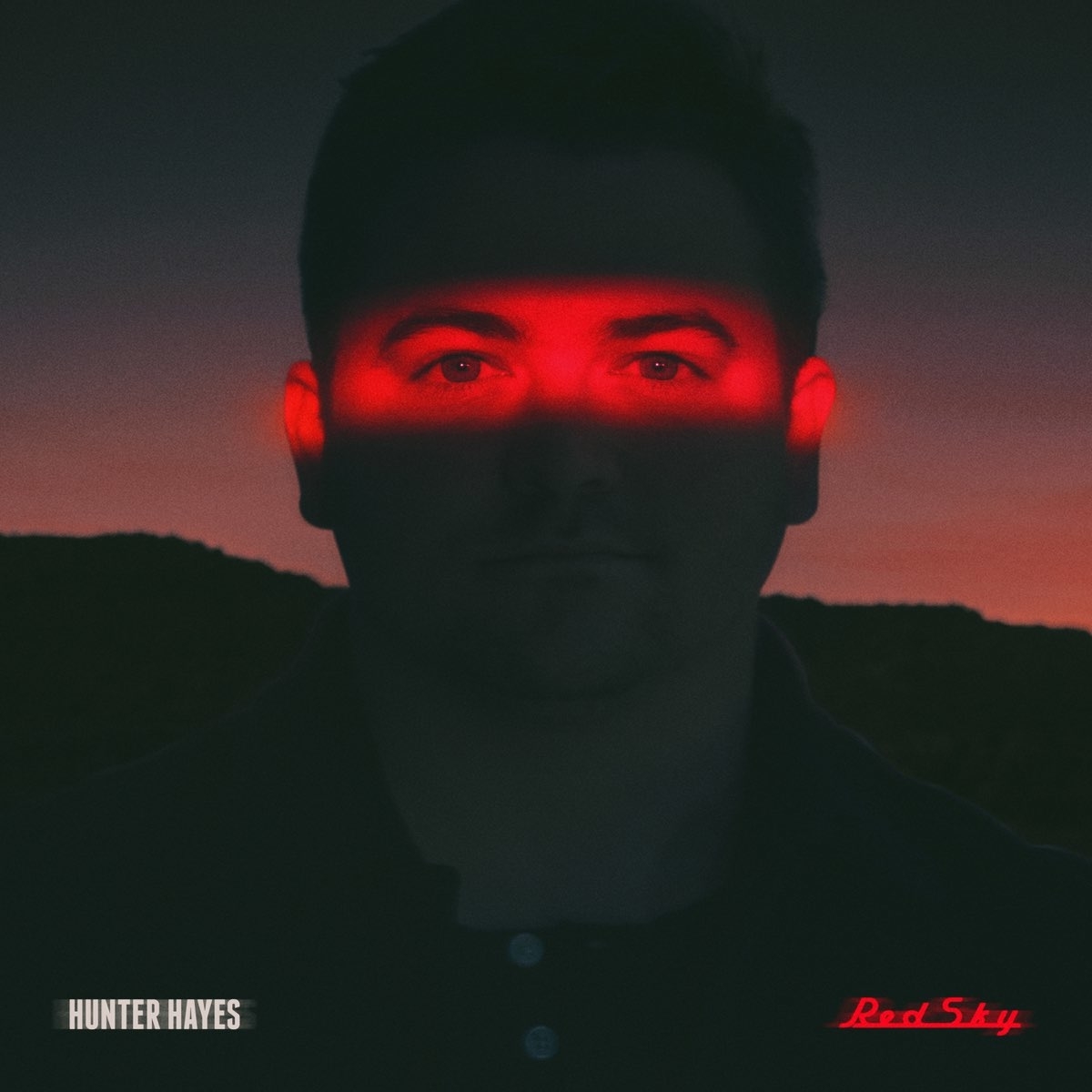 Album cover for Red Sky by Hunter Hayes, showing Hunter&#x27;s eyes illuminated in red