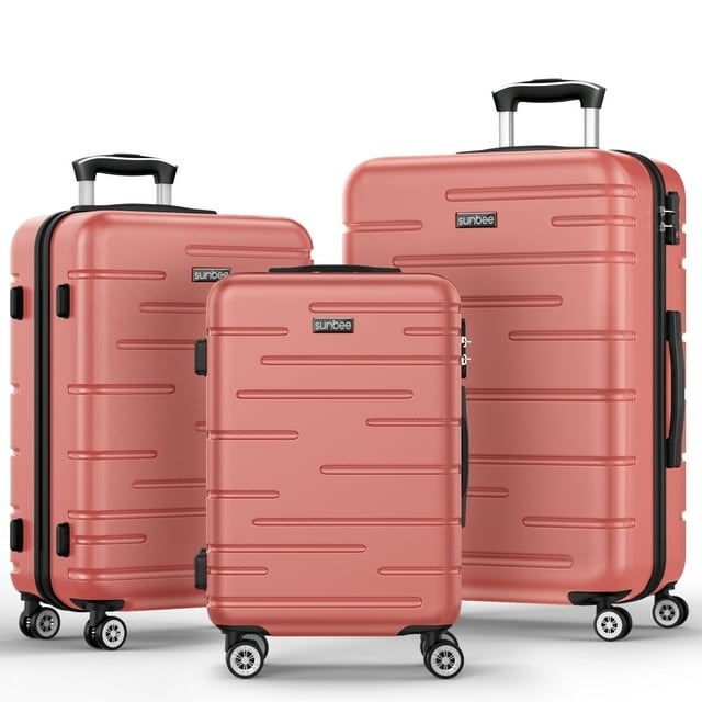 the three piece set of pink luggage