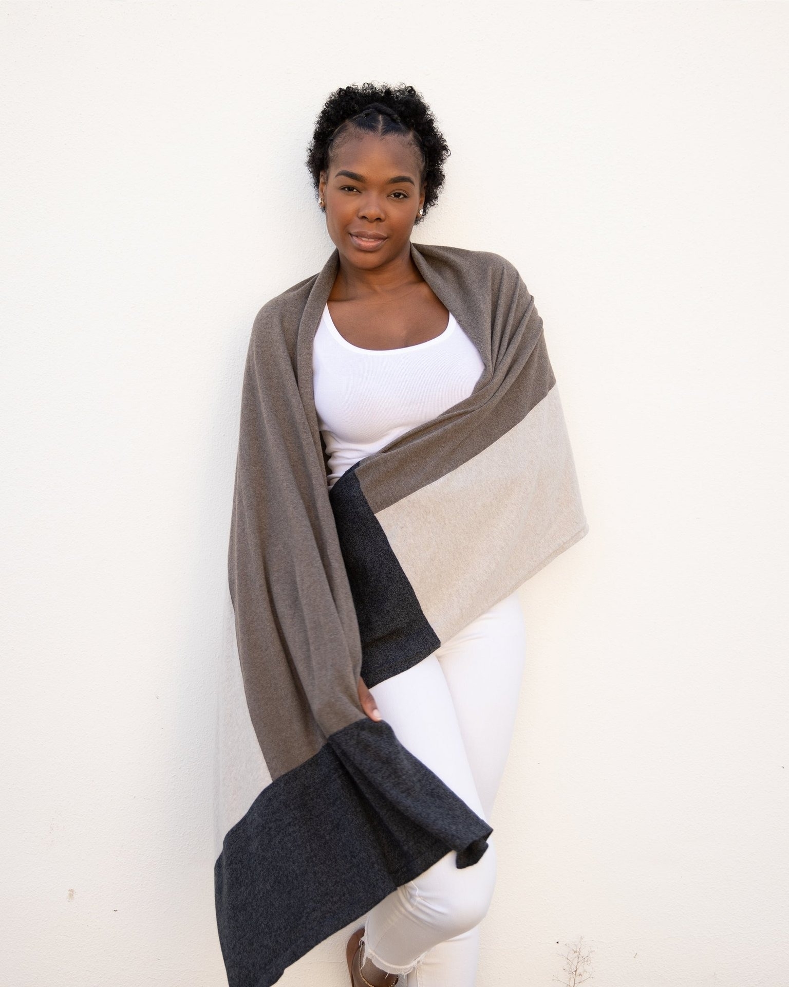 model wearing brown, black, and white travel scarf