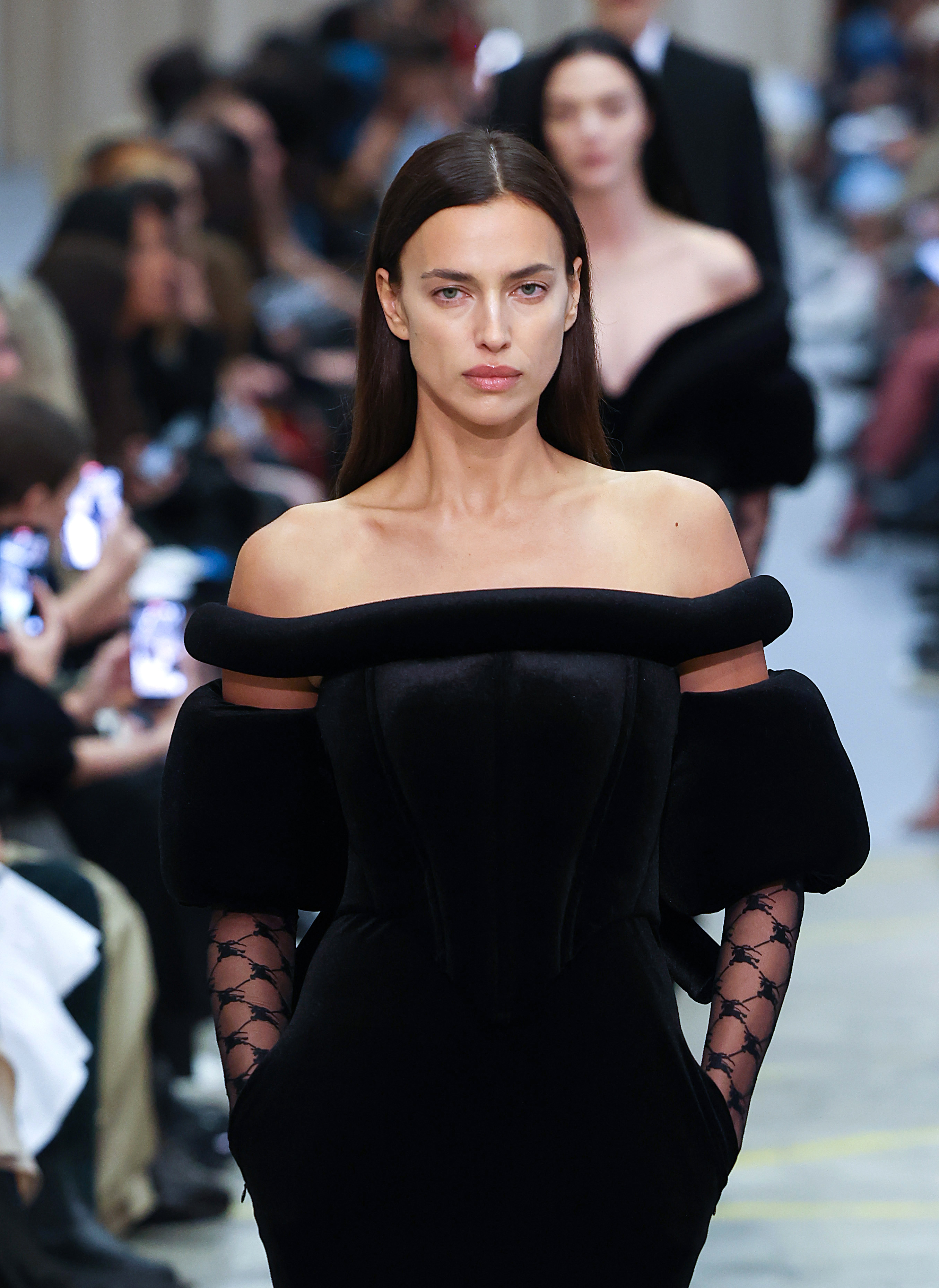 Close-up of Irina modeling an off-the-shoulder outfit