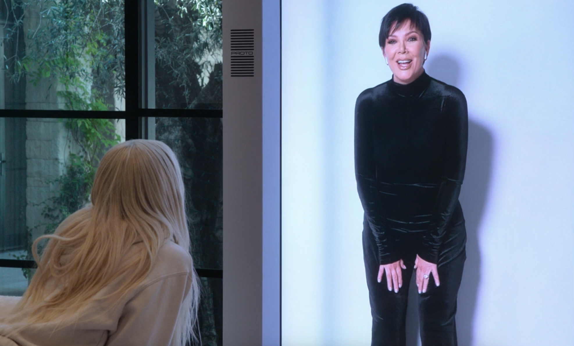 Close-up of Khloé looking at the hologram