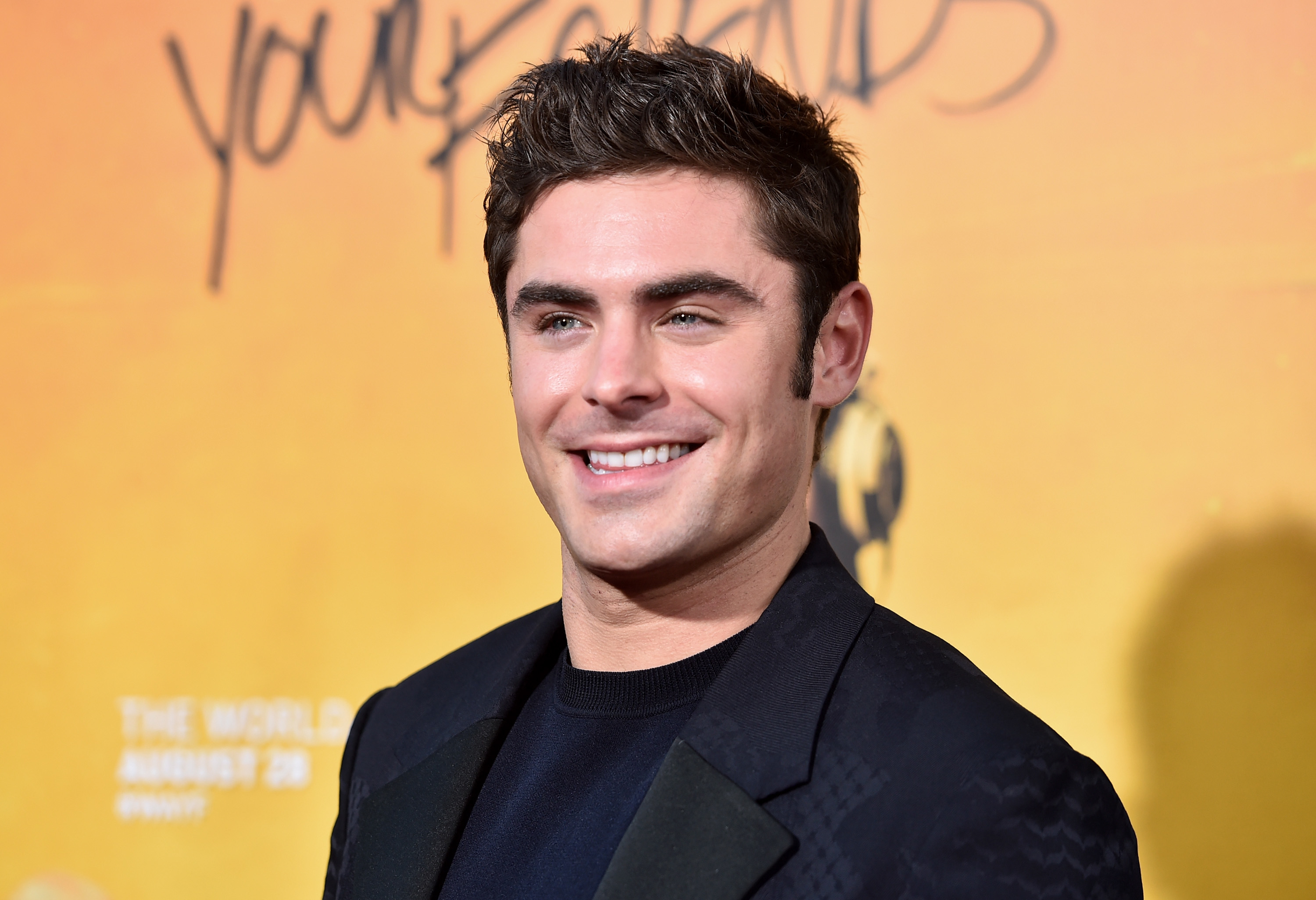 A younger? Zac Efron smiling