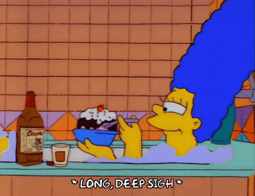 a gif of Marge sinking into a bath tub and text reading &quot;*long, deep sigh*&quot;