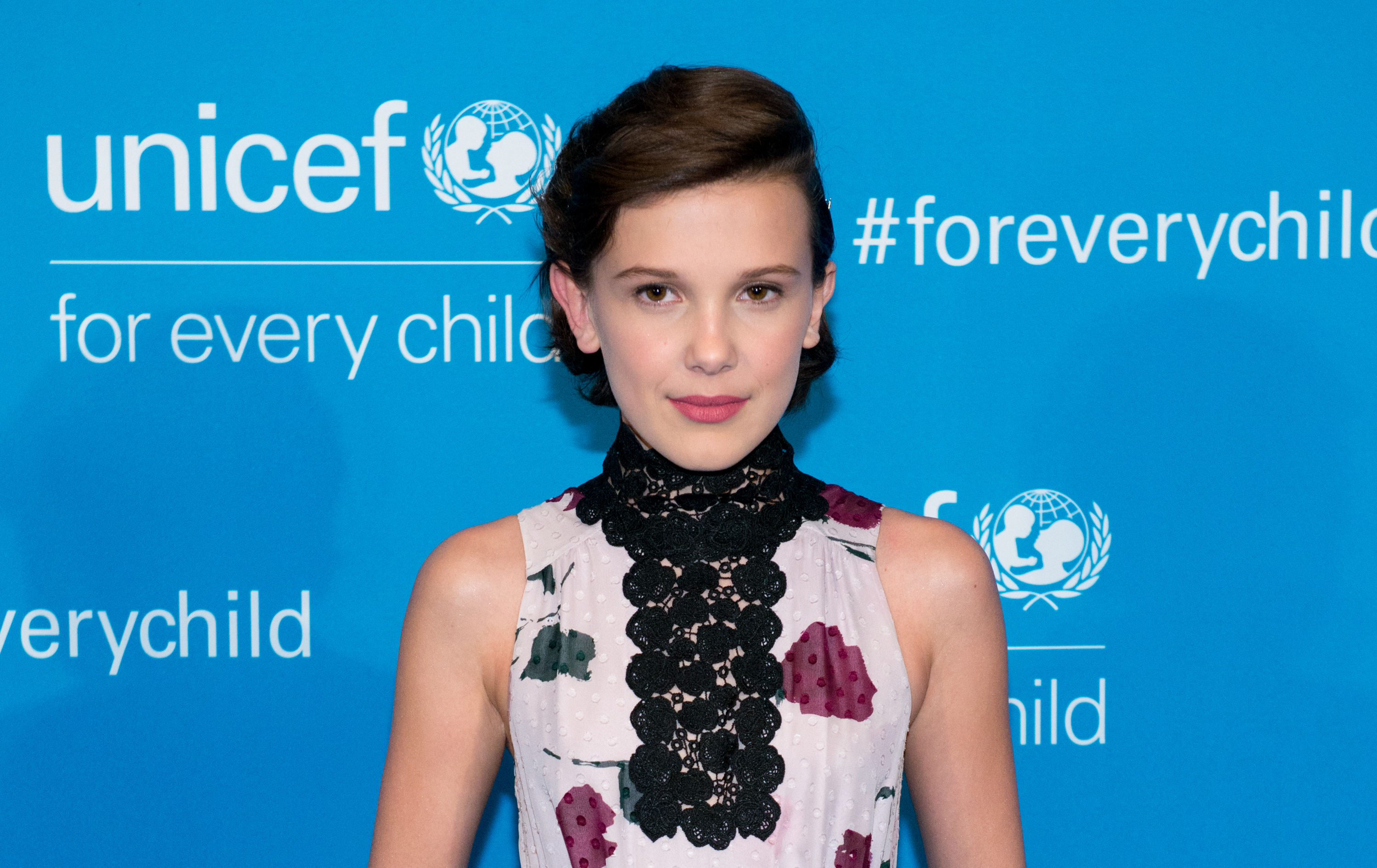 Close-up of Millie as a child at a media event