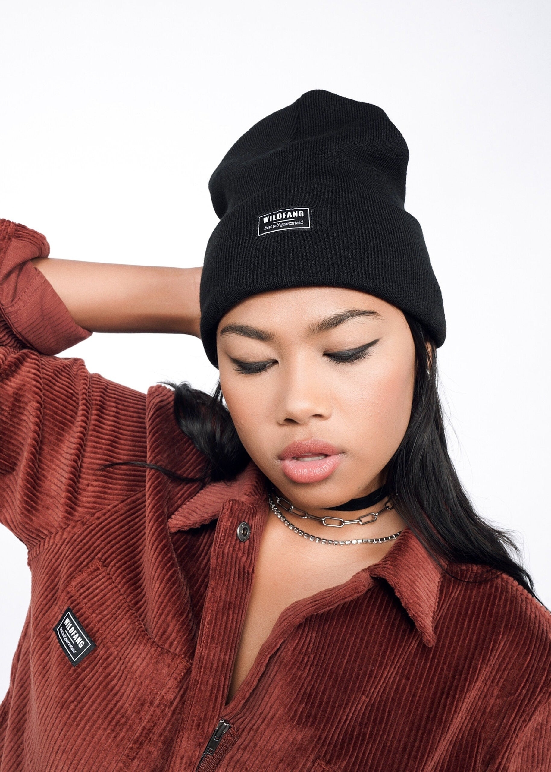 model wearing red Wildfang beanie