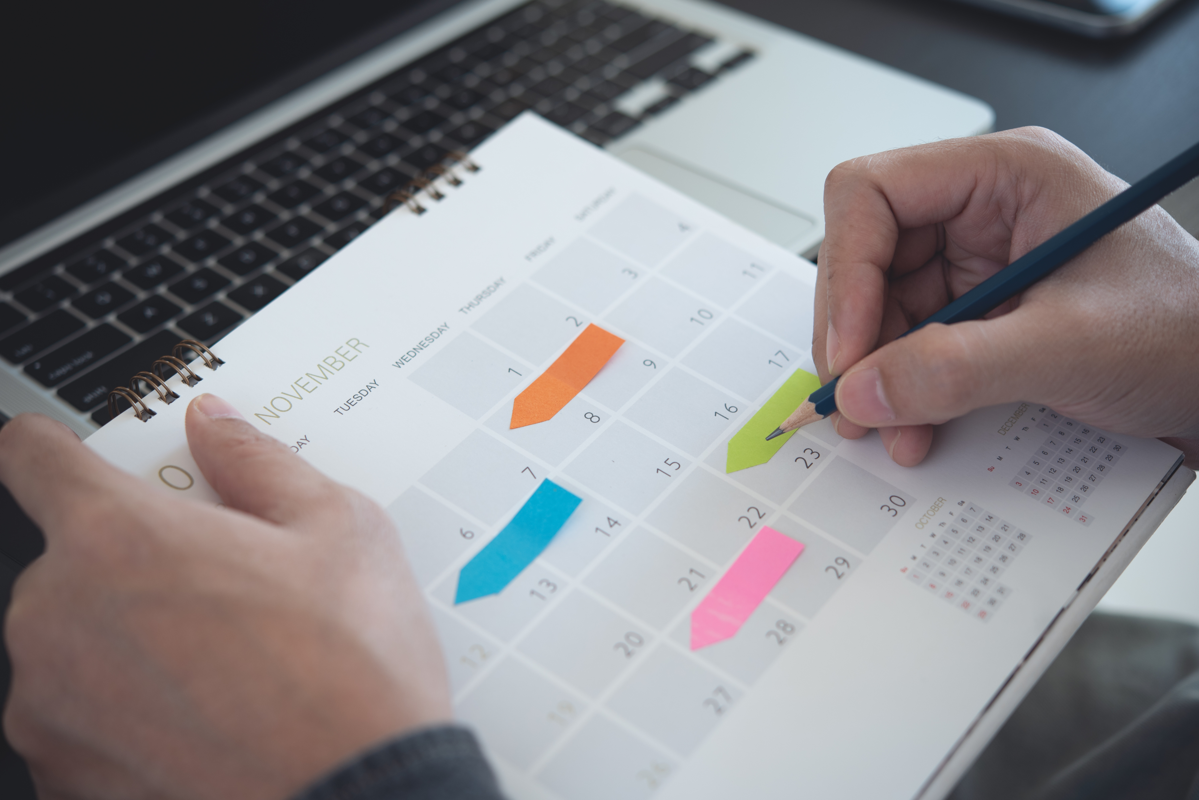 Someone updating a written calendar