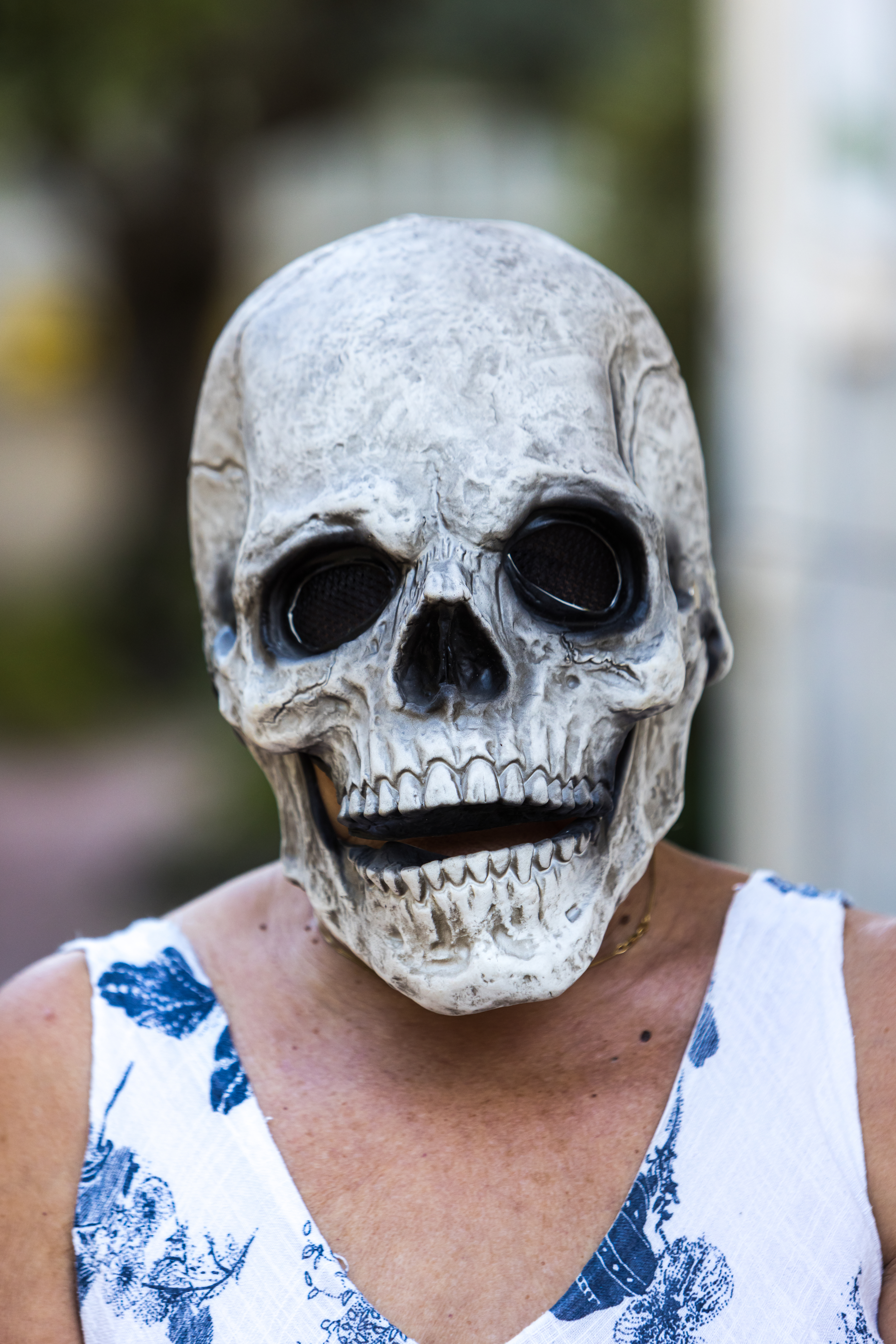 Close-up of a person wearing a skull mask