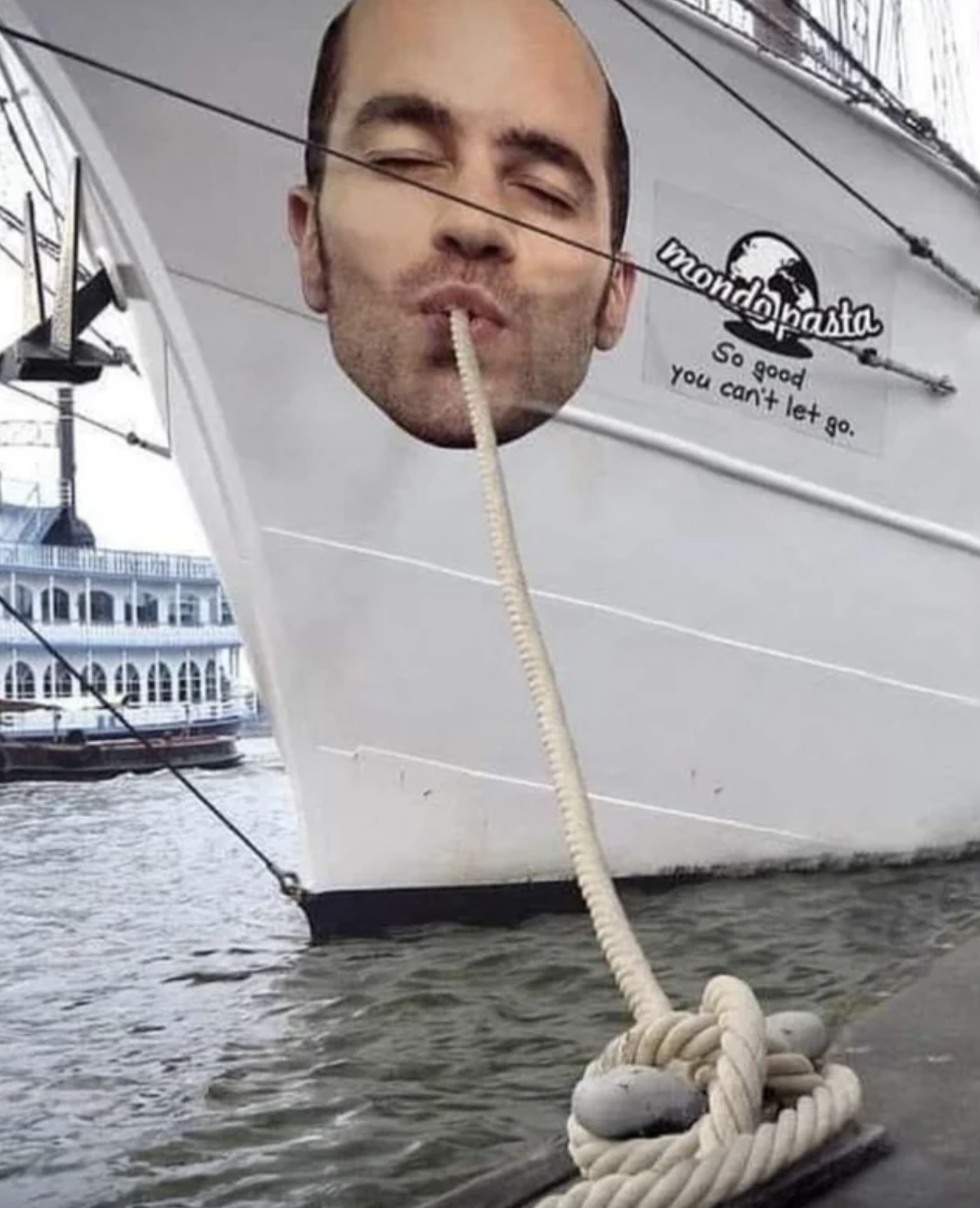 a rope coming out of a man's face on the side of a boat