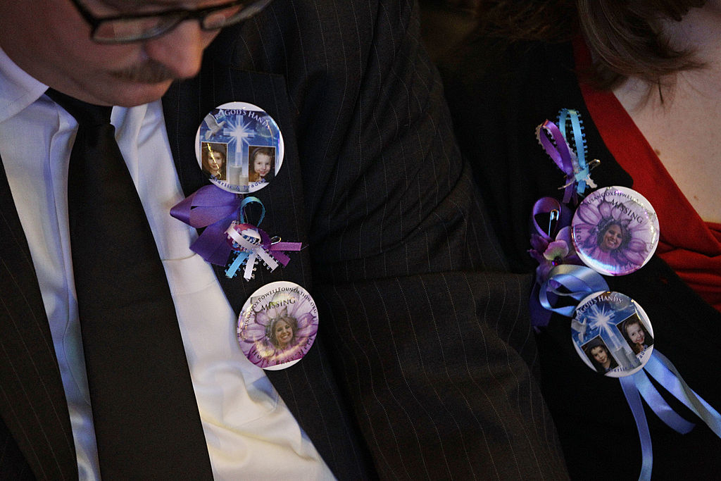 closeup of pins of the missing person on jackets