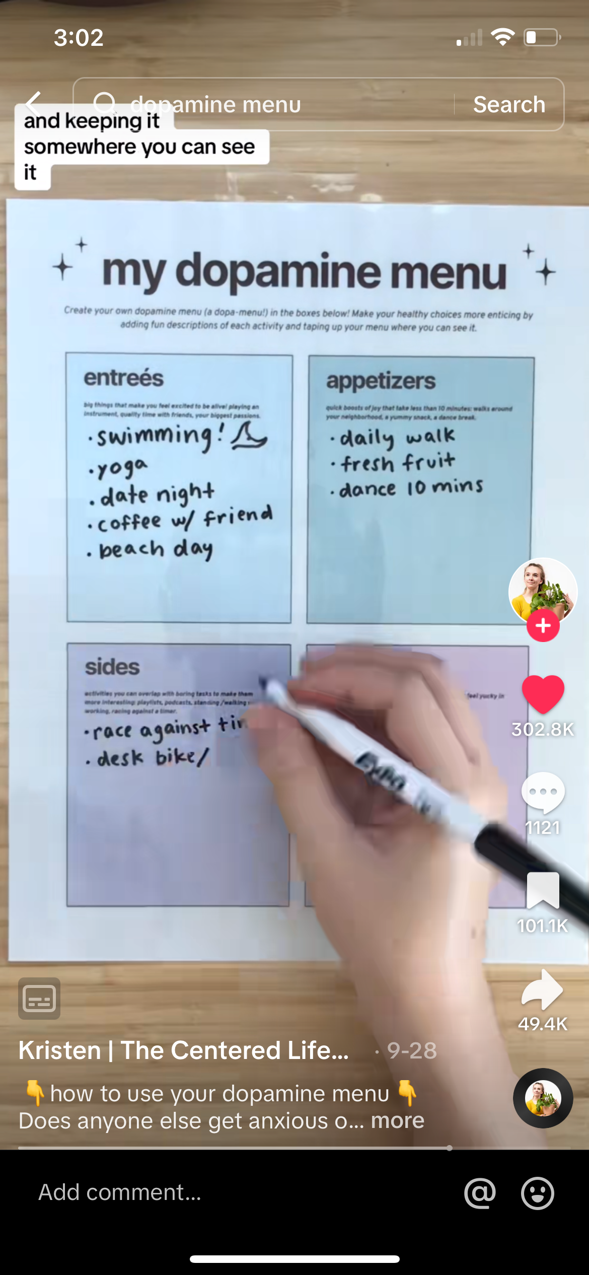woman filling in a dopamine menu worksheet with a marker