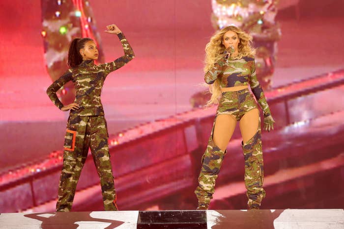 Blue Ivy and Beyoncé in fatigues onstage