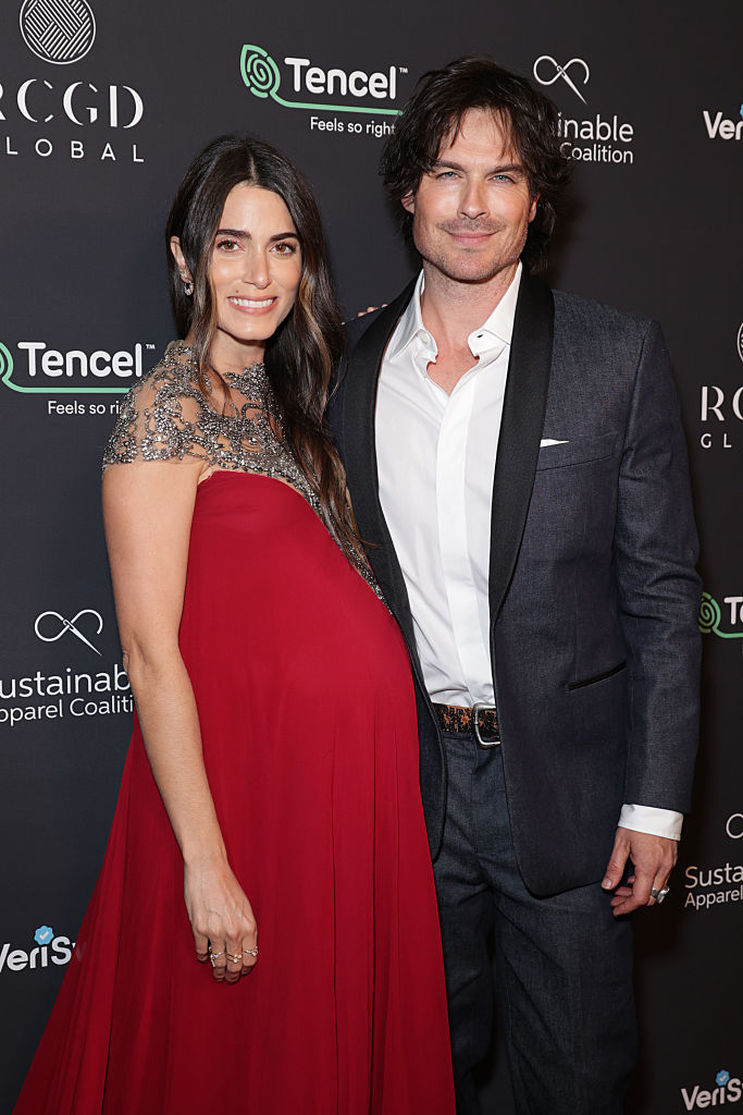 A pregnant Nikki with Ian Somerhalder at a media event
