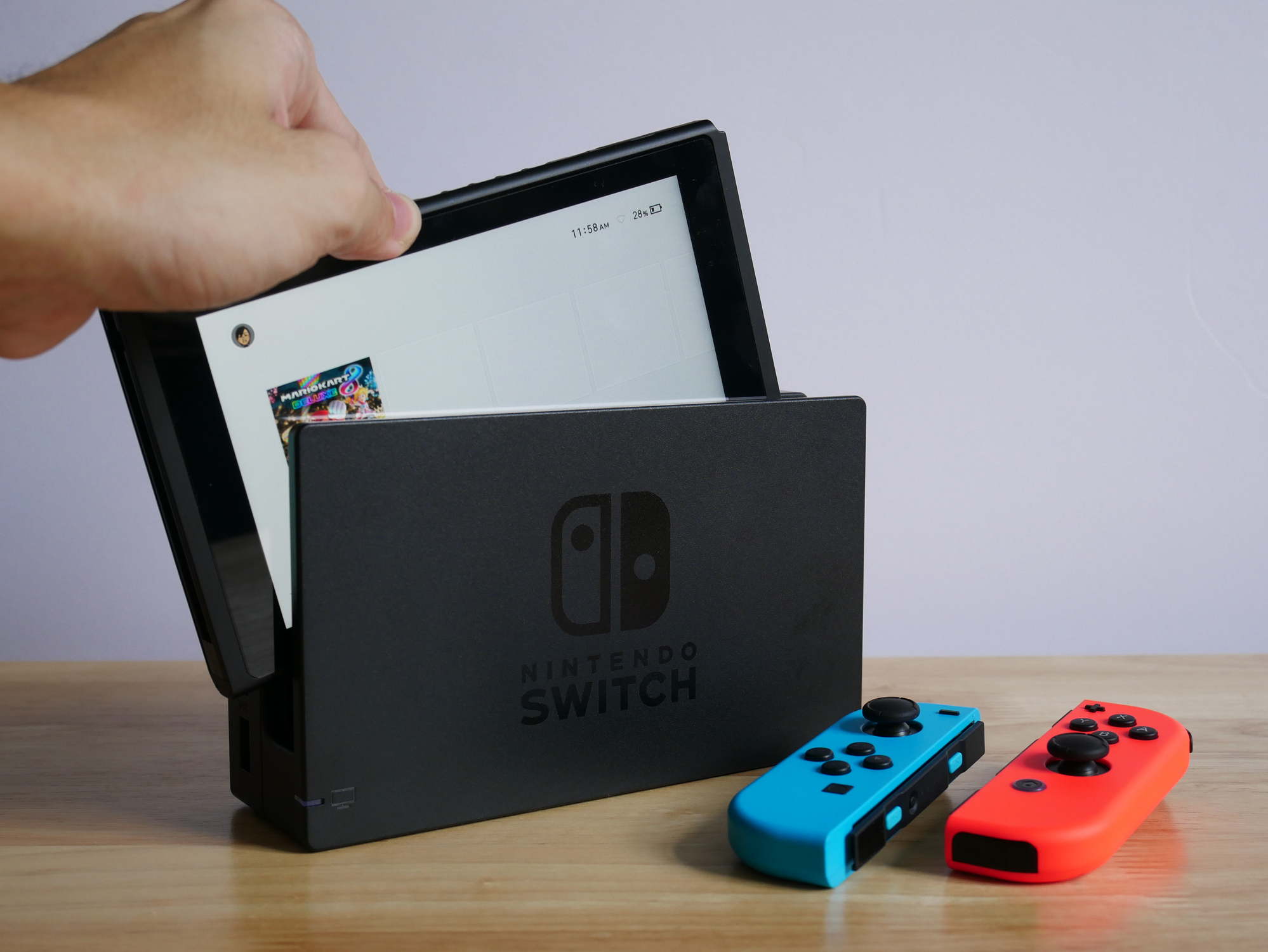 Someone holding a Nintendo Switch