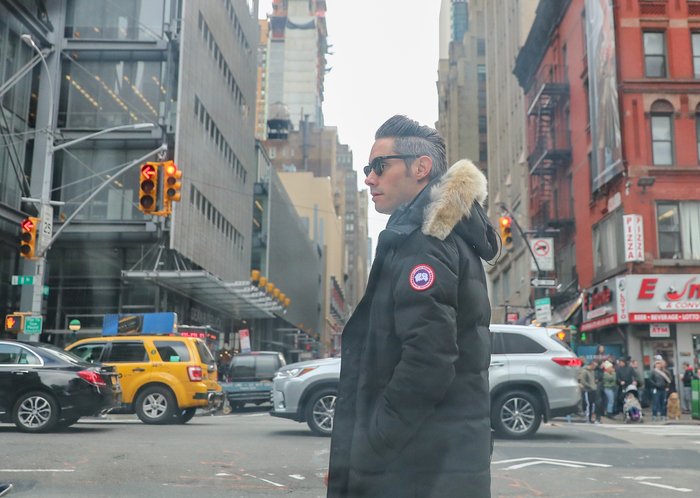 A man in a winter coat walking in New York City