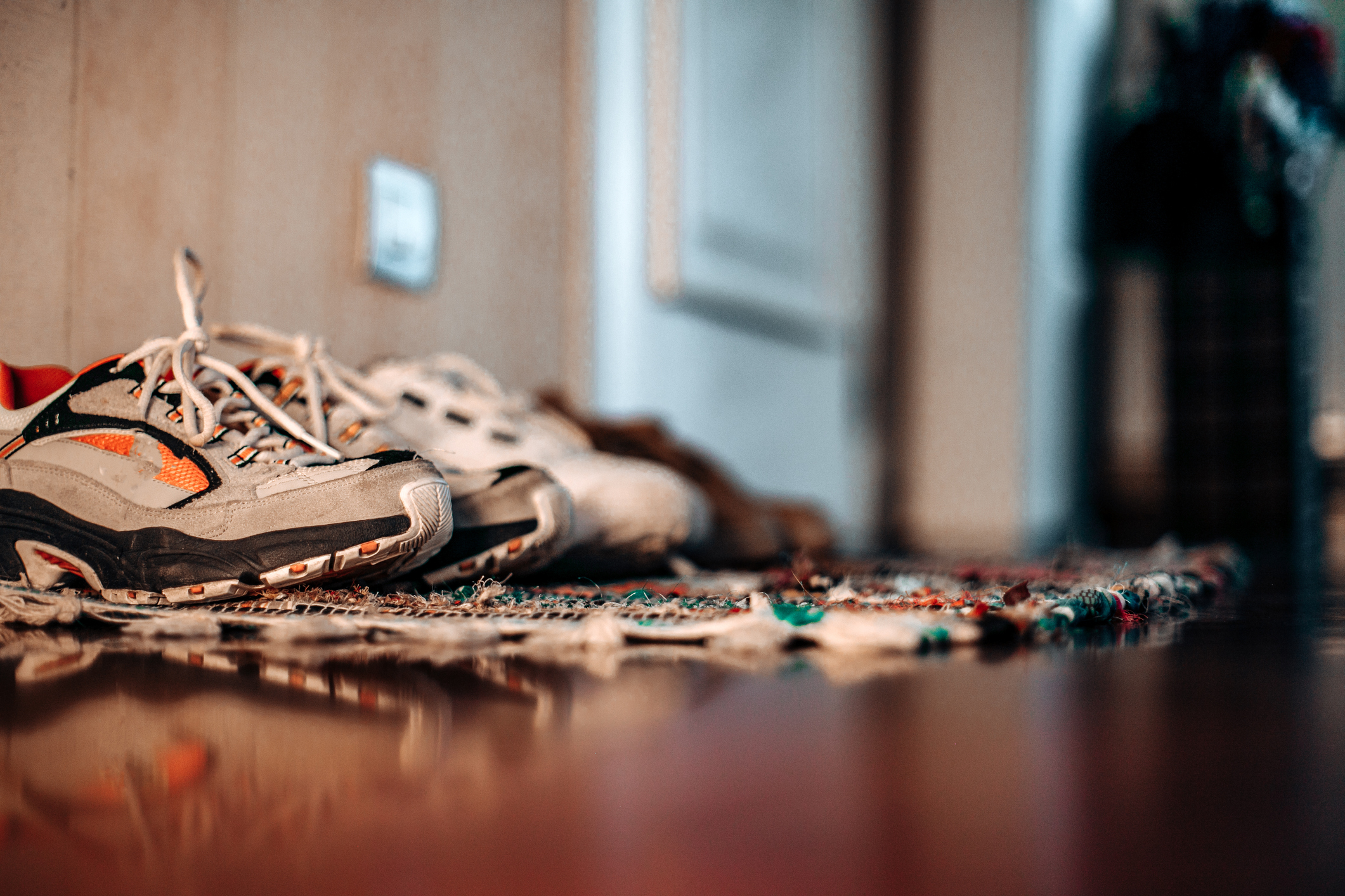 Shoes lined up on a rug
