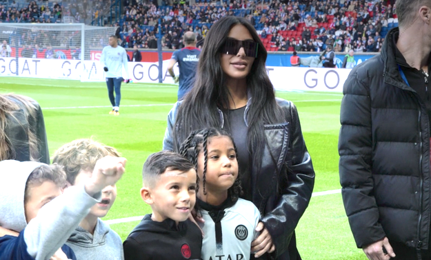 Kim with Saint and his friends at a soccer game
