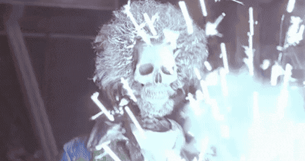 A skeleton with a wig and flames.