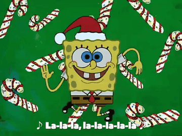 SpongeBob dancing and singing in a Santa hat.