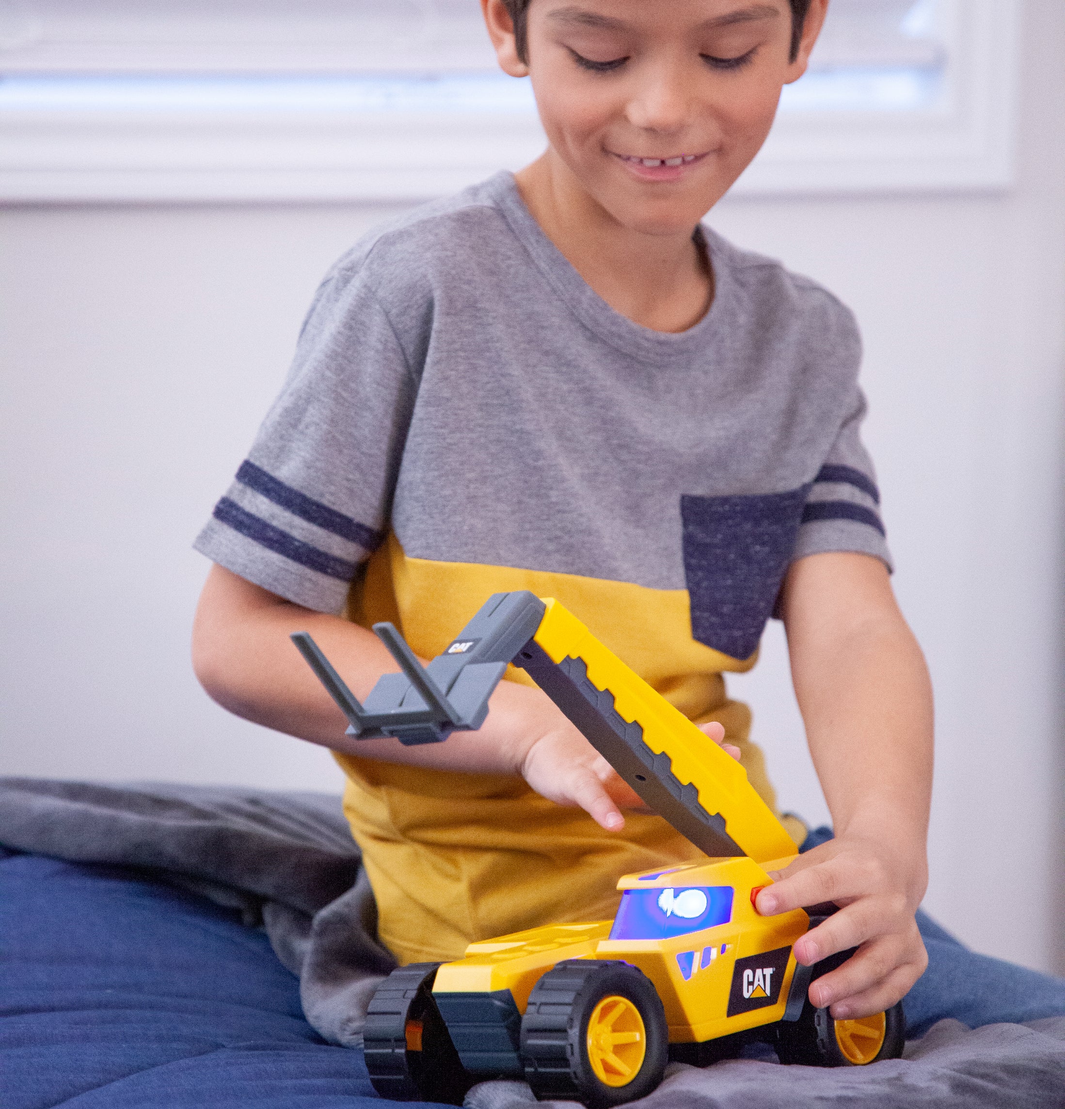 a child playing with the futuristic version of the telehandler
