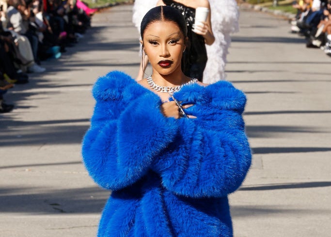 Close-up of Cardi modeling a furry coat