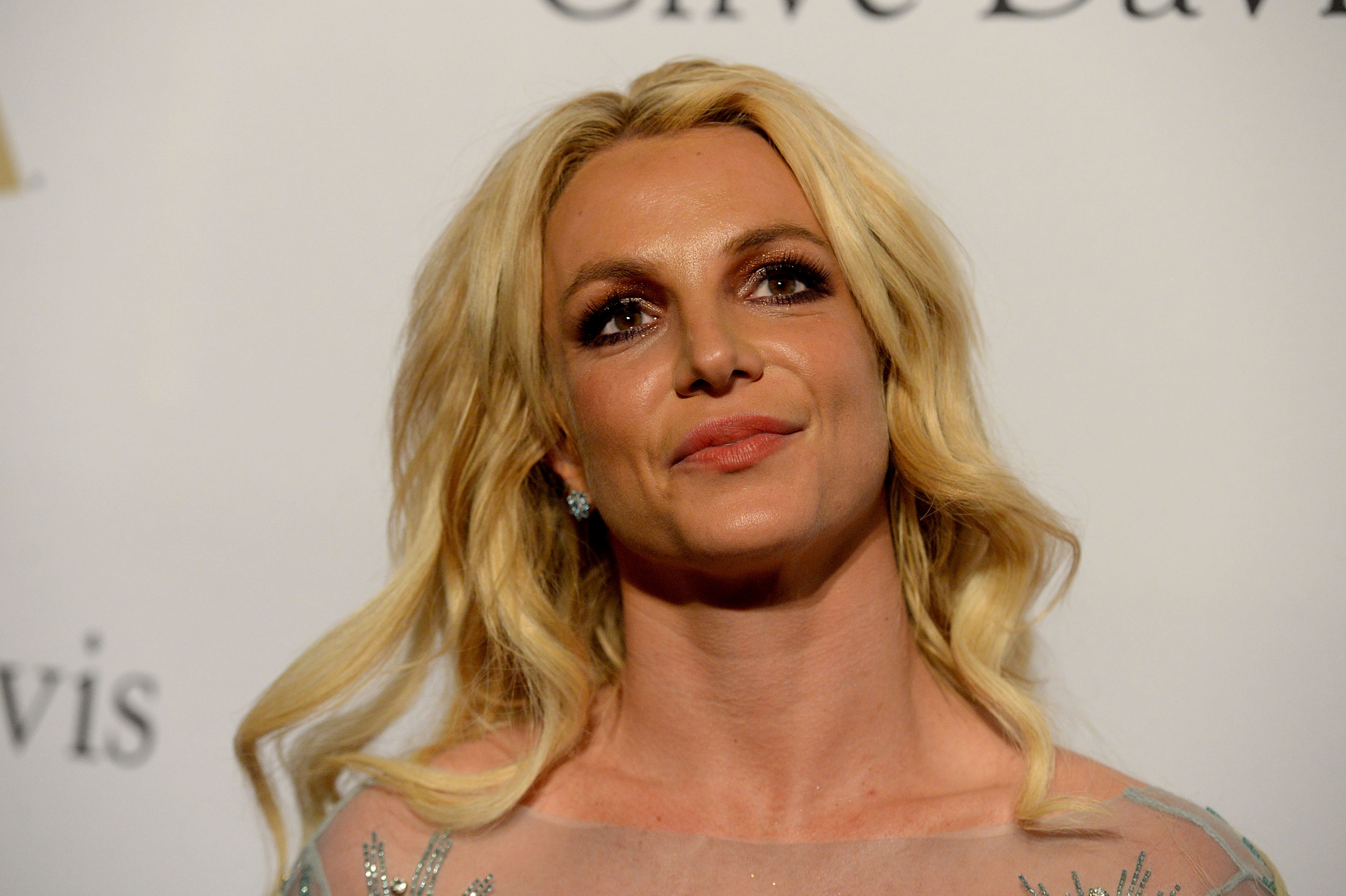Close-up of Britney smiling at a media event