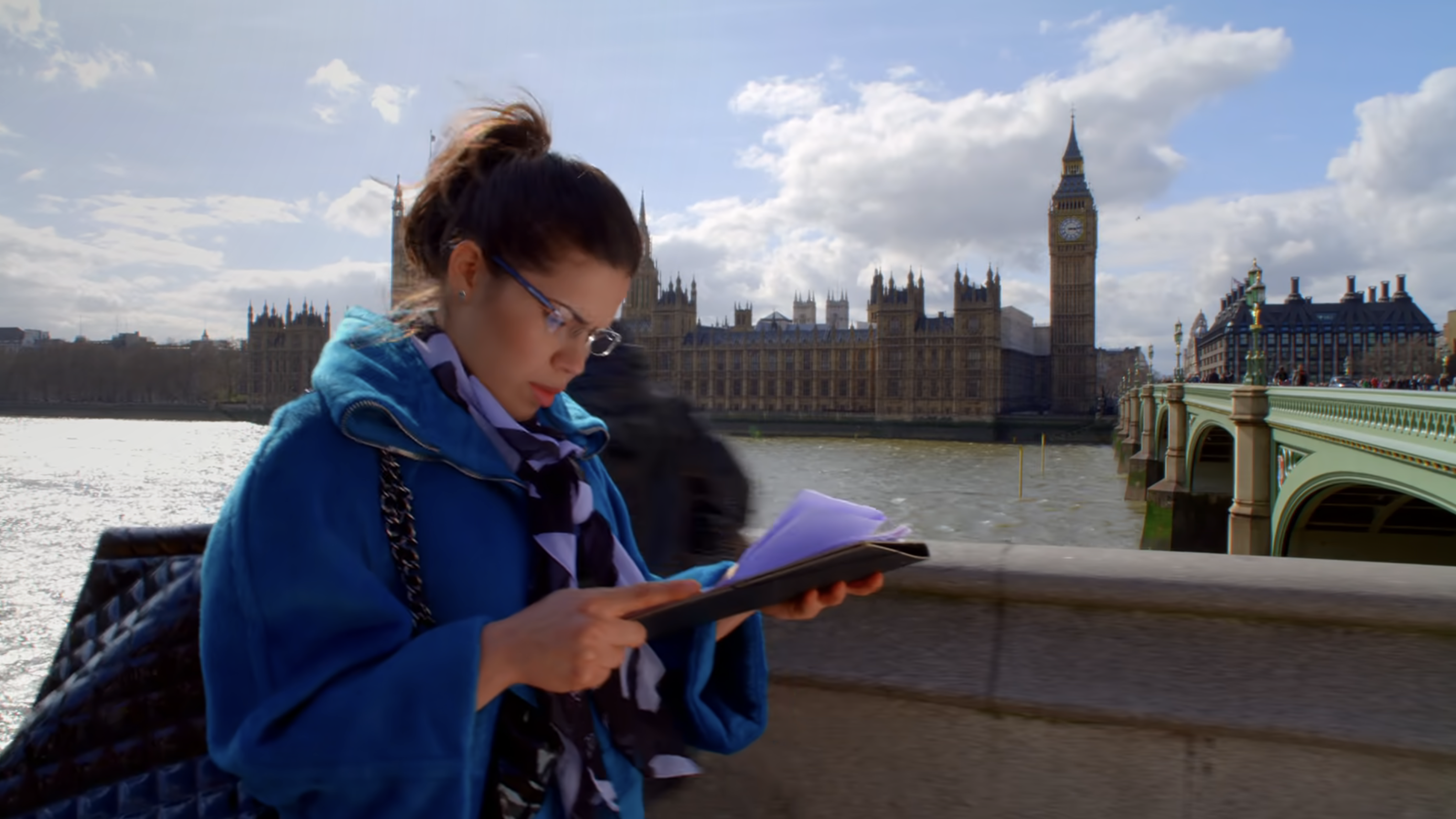A woman looking at a paper in London