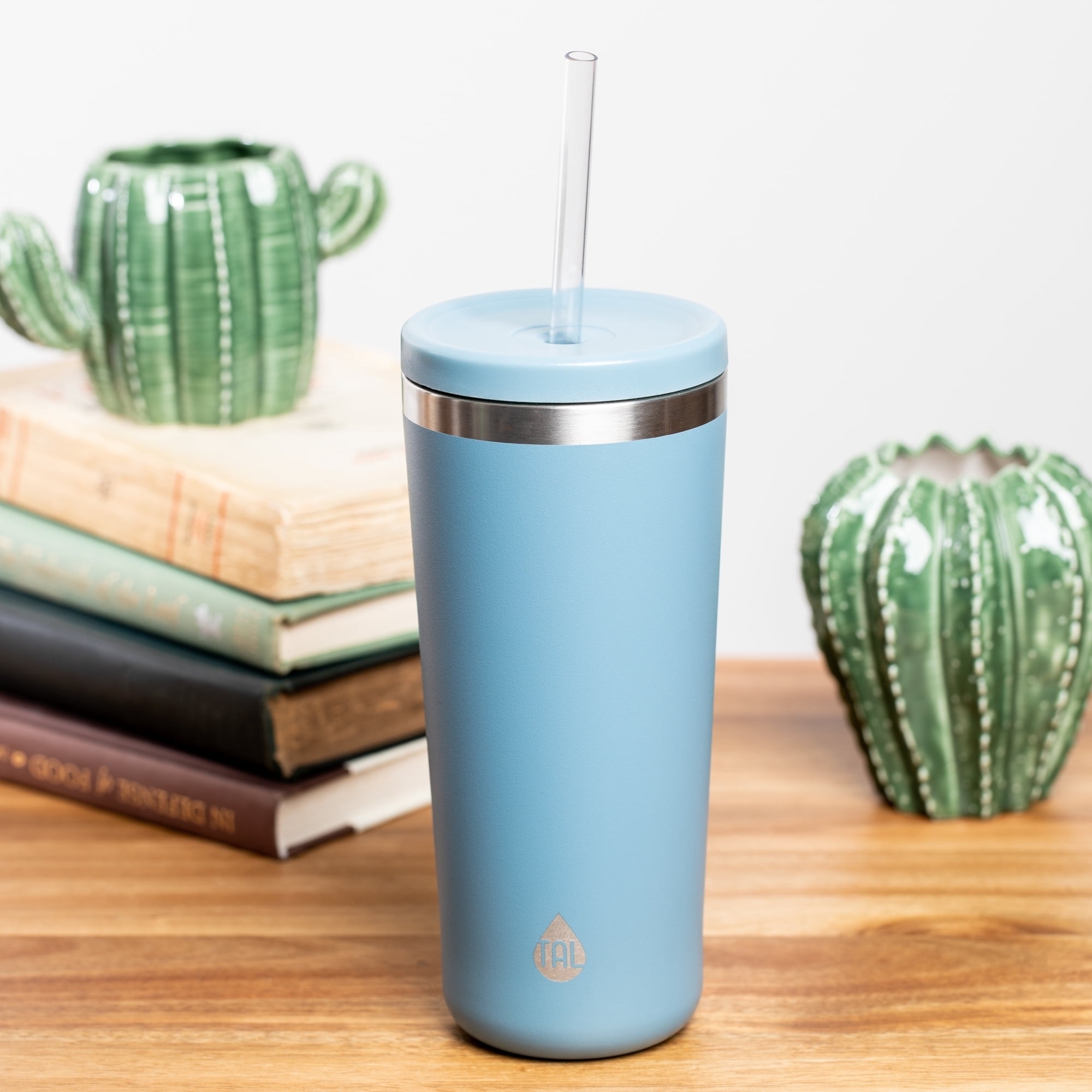 mint tumbler on desk with straw