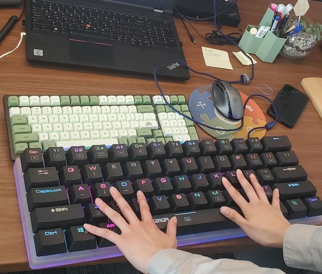 a person&#x27;s hands using a giant keyboard