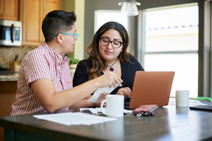 lesbian couple going over their finances together