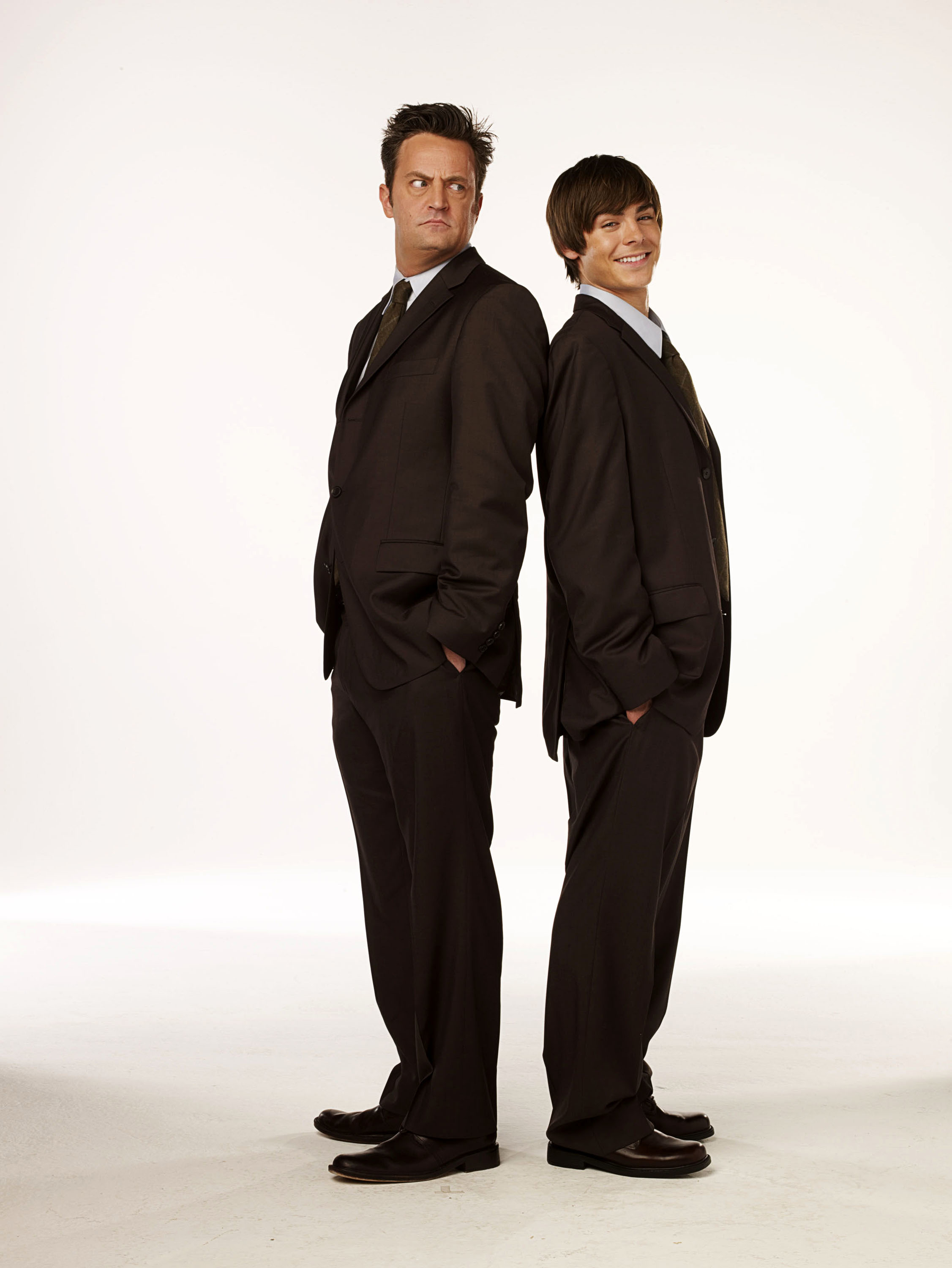 Matthew Perry and Zac Efron in suits