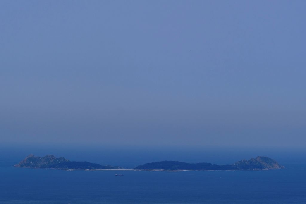 The smoke cloud produced by the multiple wildfires ongoing in Quebec is seen over the Cies Islands next to the coast of Vigo, Spain