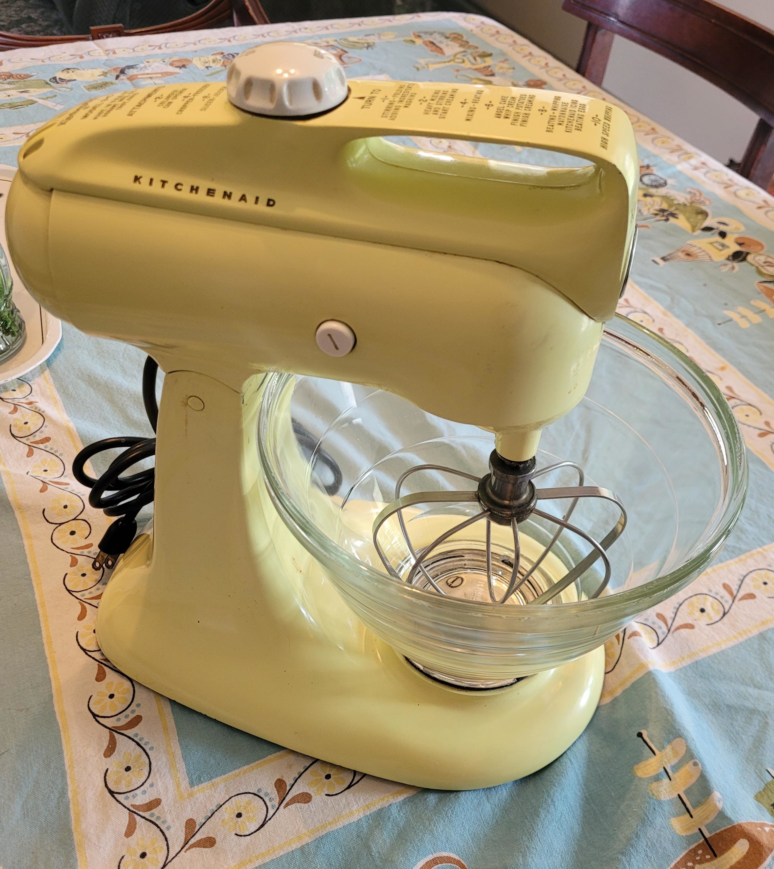 a vintage yellow kitchenaid mixer