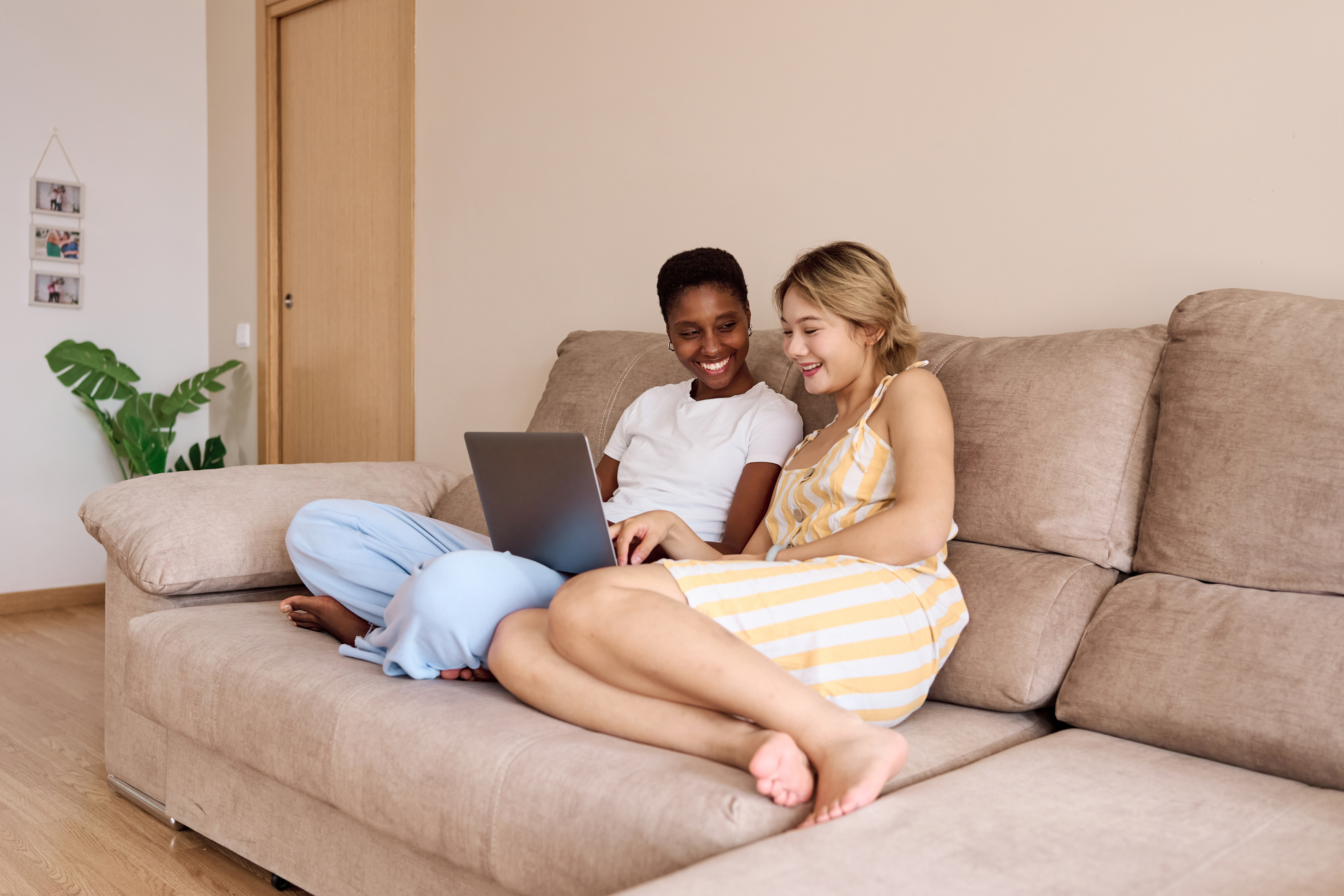 lesbian couple hanging out on the couch together