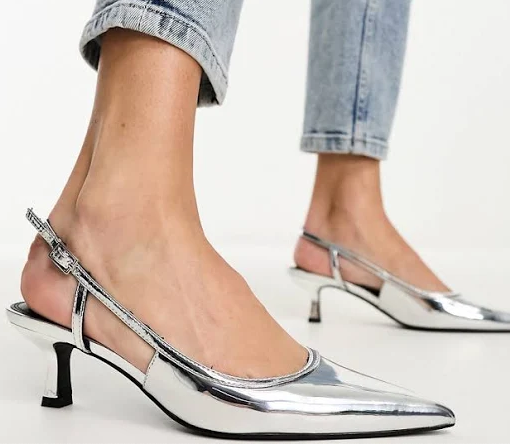 closeup of a woman&#x27;s silver shoes