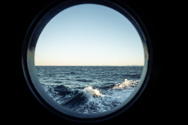 view from a ship&#x27;s window of the ocean