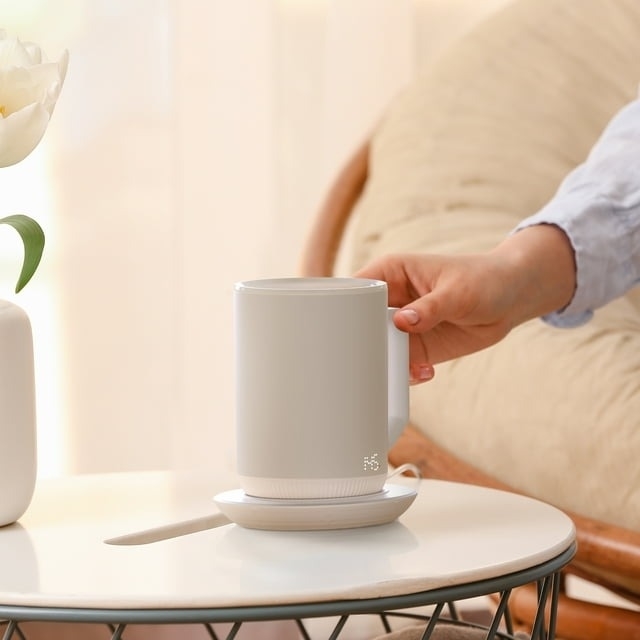 white ionMug and charging coaster on table