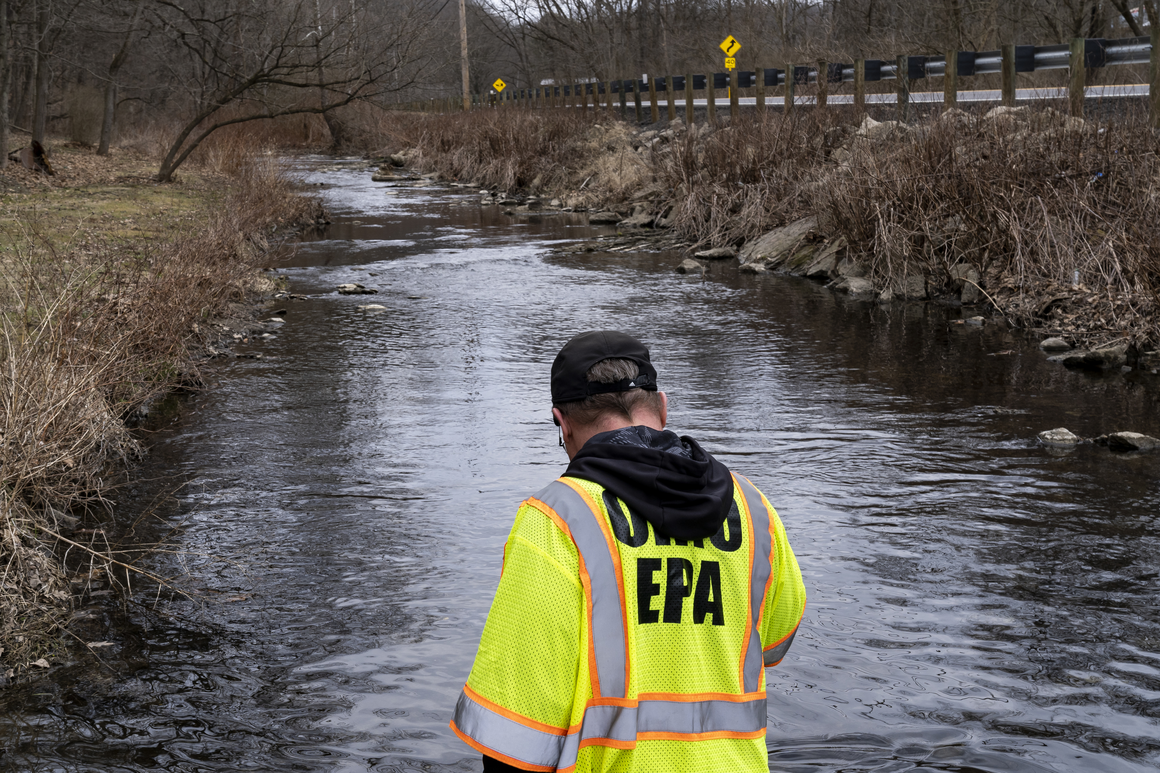 Ohio EPA Emergency Response, looks for signs of fish and also agitates the water in Leslie Run creek to check for chemicals
