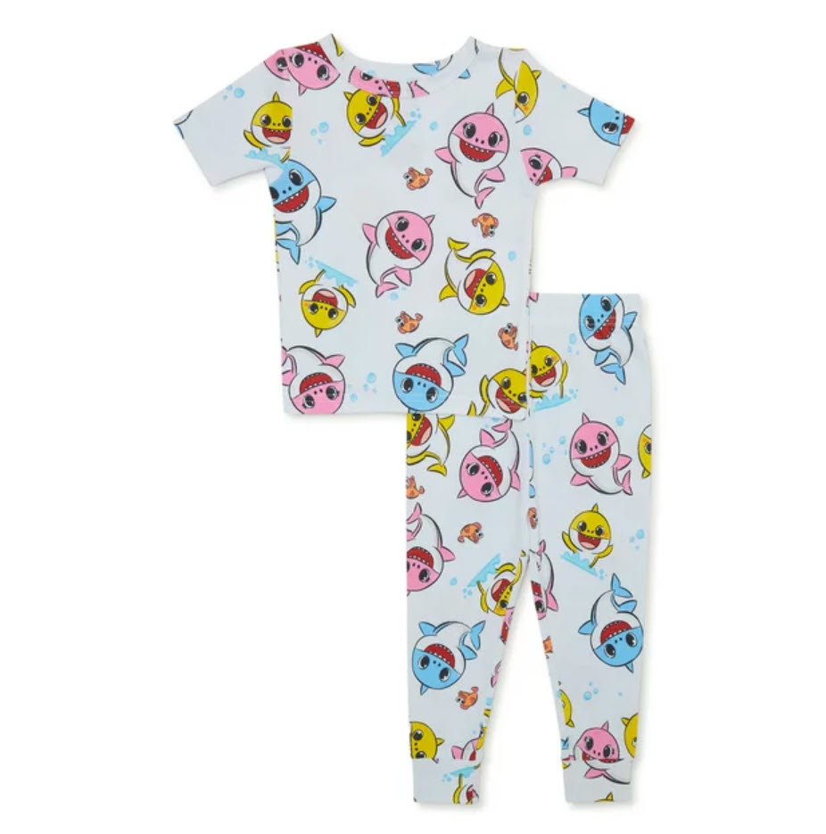 baby shark pajamas in white with pink, blue, and yellow sharks