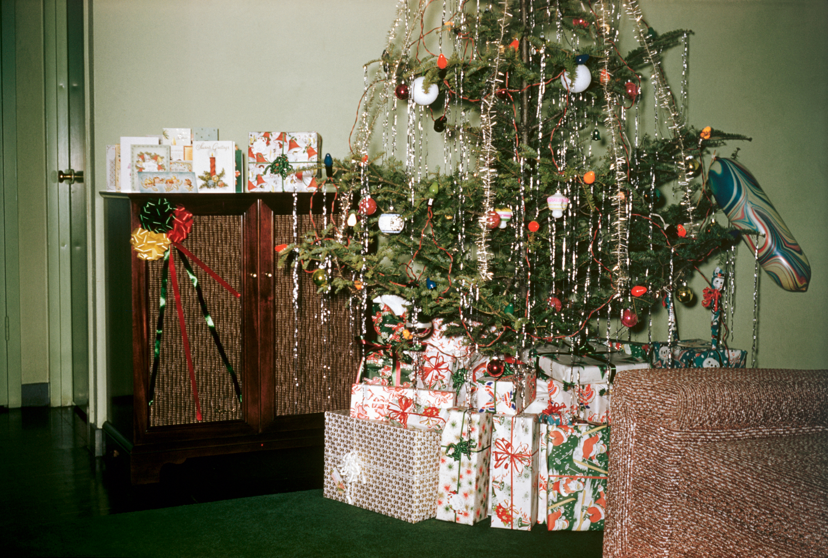 vintage photograph of a christmas tree and presents