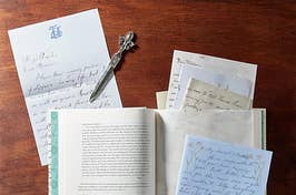 The opened book with pulled out letters and other texts