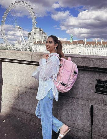 Reviewer wearing the pink backpack on a trip