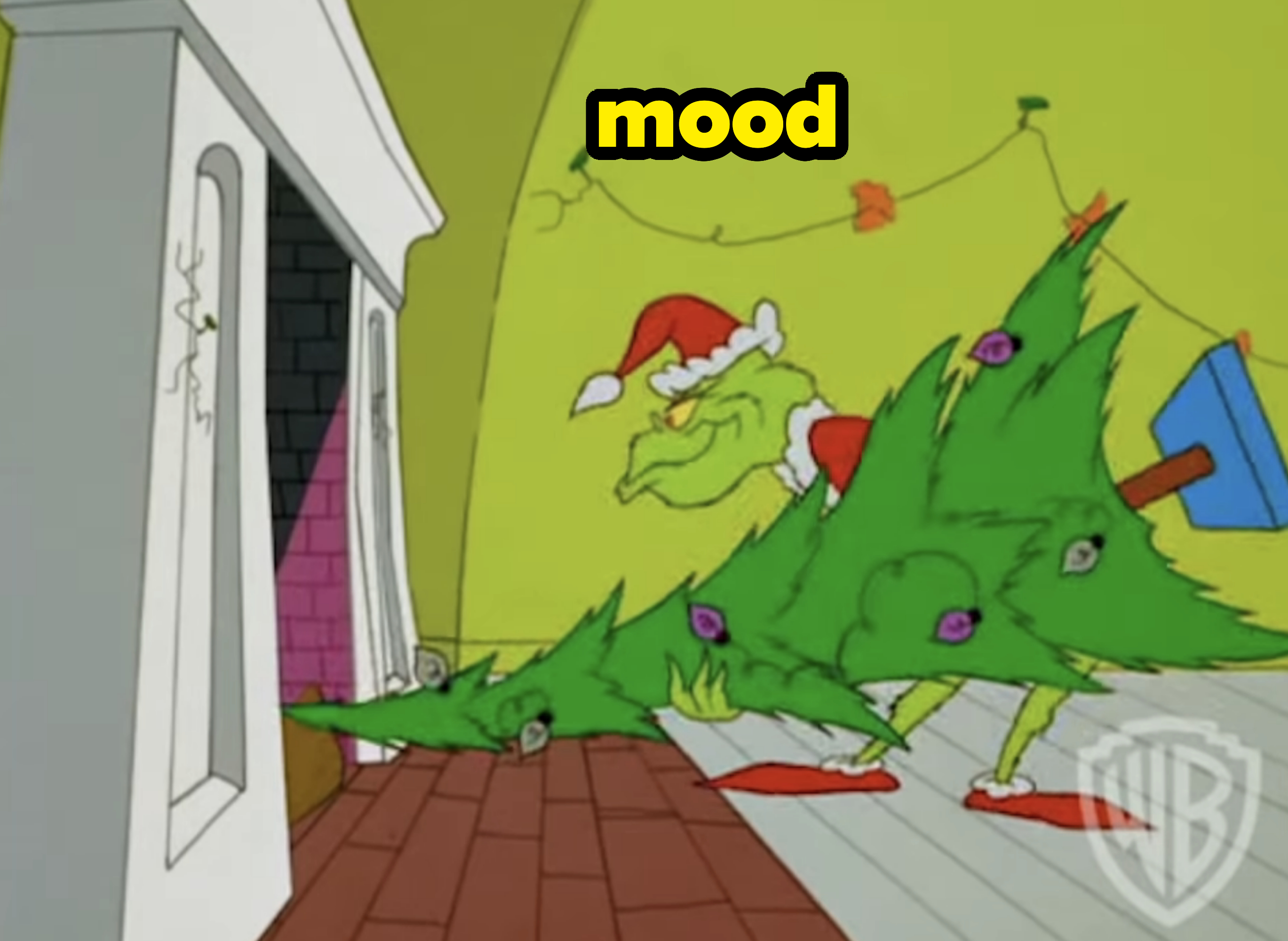 grinch putting a tree in the chimney