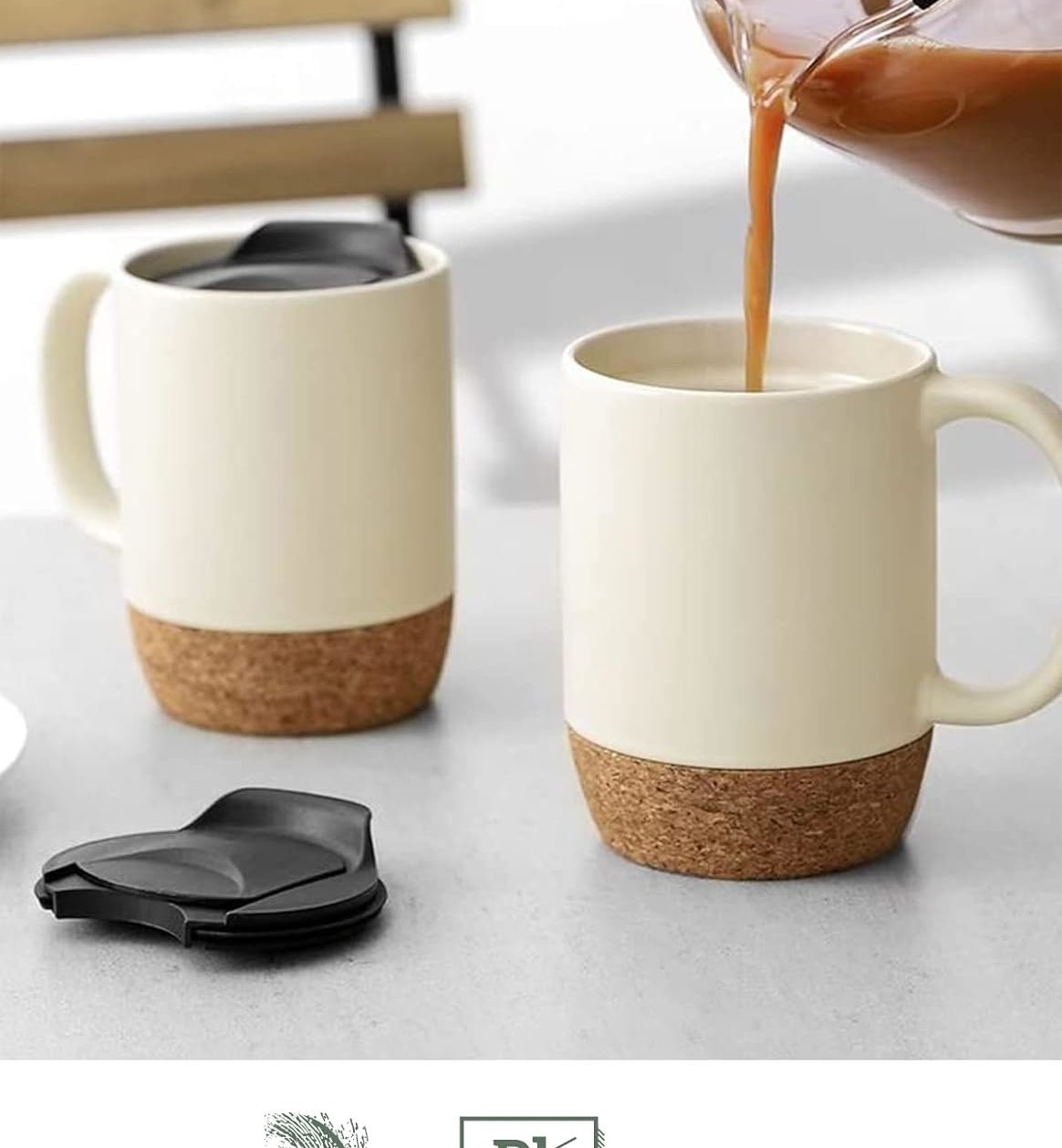 two ceramic mugs with cork base and splash-proof lids