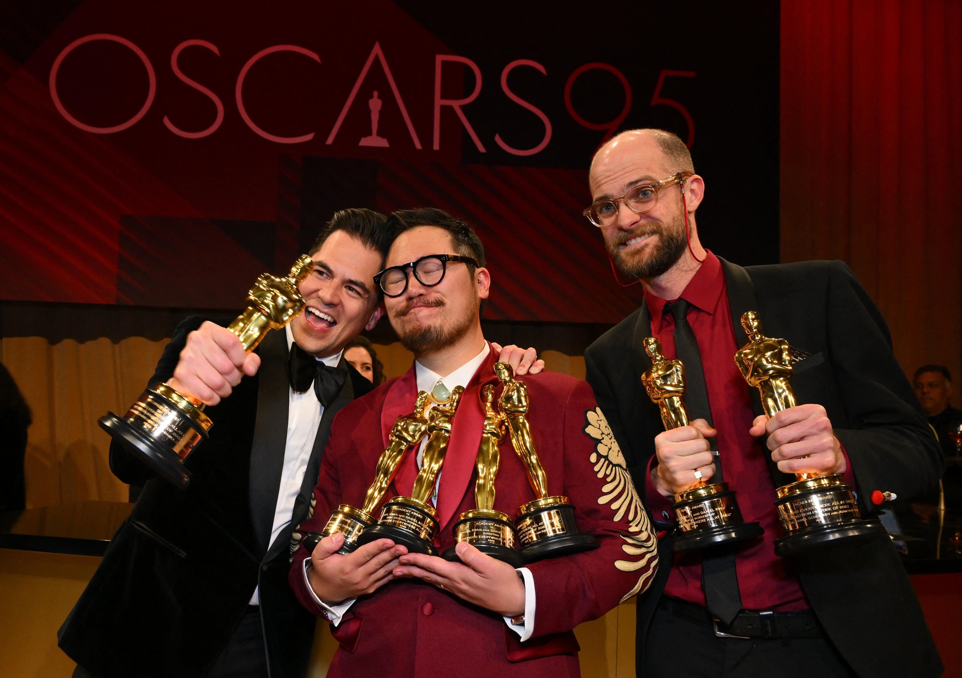 The producer and directors of &quot;Everything Everywhere All at Once&quot; holding their Oscars