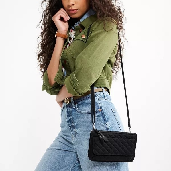 black quilted crossbody on model