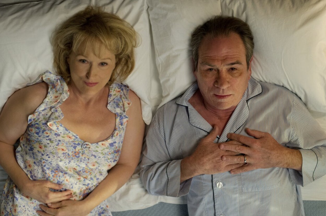Meryl Streep and Tommy Lee Jones lying in bed next to each other, as seen in the film "Hope Springs"